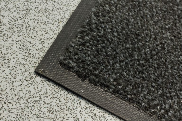 An anti fatigue mat from Rocliff on the floor of a workplace.